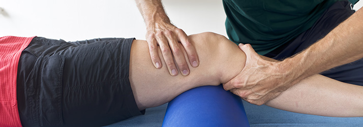 Athlete getting his leg tested after a sports injury.